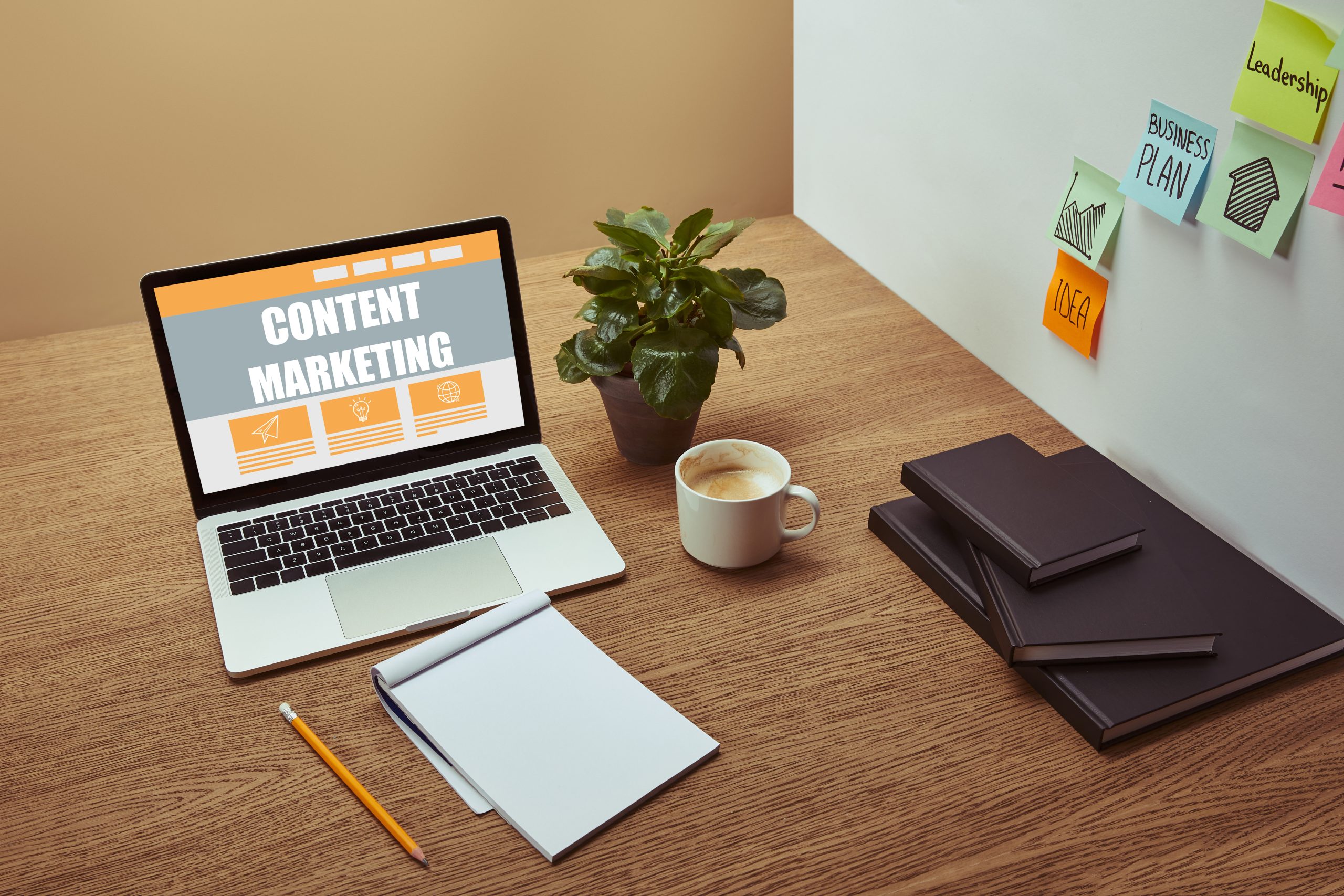 Laptop on a desk with the text: "Content Marketing"