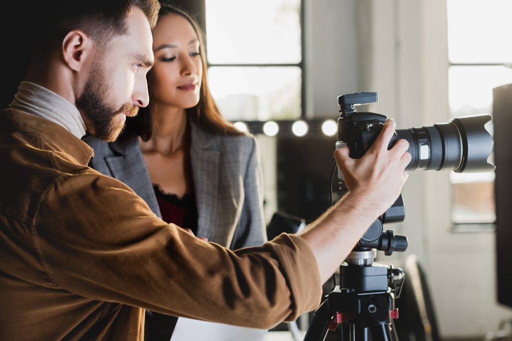 A business woman working in tandem with a photographer